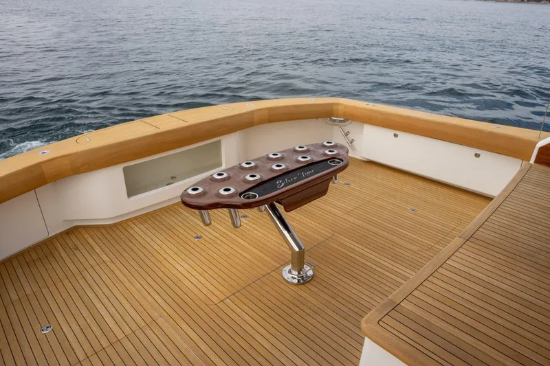 Slide: The Image of 2018 Viking 80 Enclosed Bridge yacht deck with fishing rod holders, ocean view. - 57