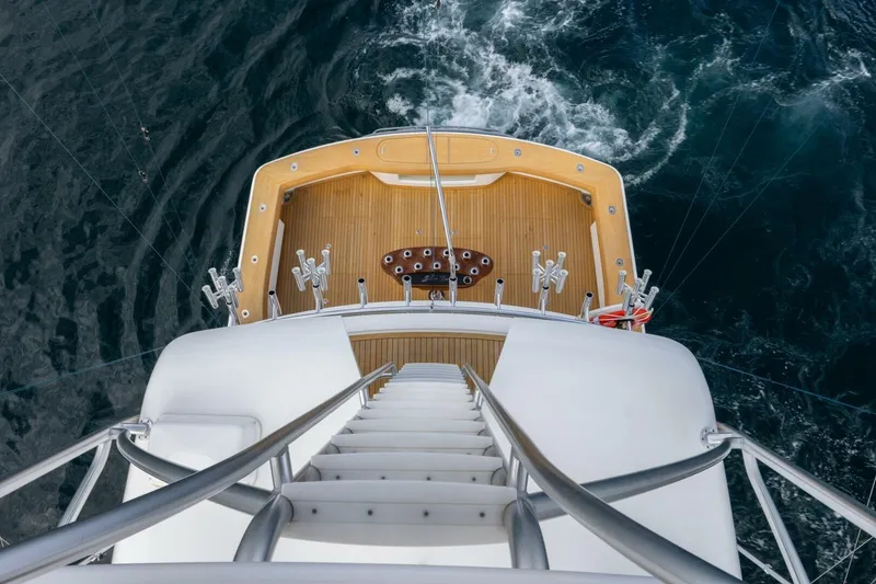 Slide: The Image of Aerial view of 2018 Viking 80 Enclosed Bridge yacht's deck and ocean. - 61