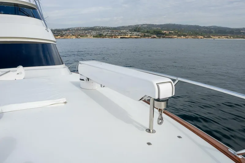 Slide: The Image of 2018 Viking 80 Enclosed Bridge yacht deck with ocean and coastal view. - 64