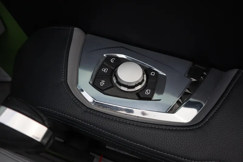 Slide: The Image of Control panel of 2021 Nautique Super Air Nautique G23 boat, featuring sleek design. - 12