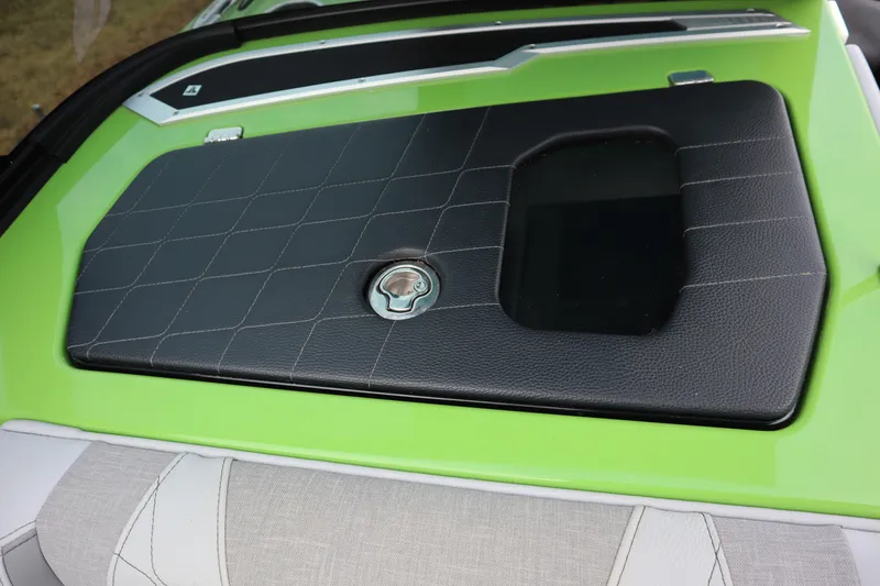 Slide: The Image of 2021 Nautique Super Air Nautique G23 boat hatch with green and black detailing. - 15