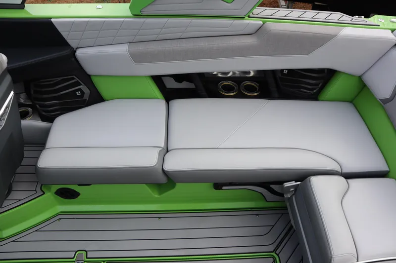 Slide: The Image of 2021 Nautique Super Air Nautique G23 interior with green and gray seating. - 20