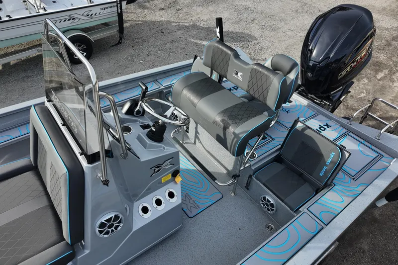 Slide: The Image of 2026 Xpress X23B Bay Lounge boat interior with modern seating and controls. - 11