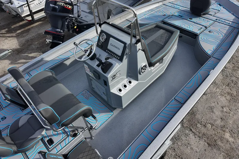 Slide: The Image of 2026 Xpress X23B Bay Lounge boat interior with modern console and seating. - 6