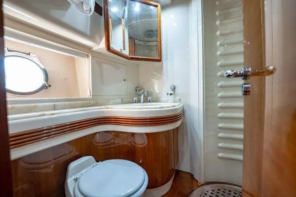 Slide: The Image of Luxurious bathroom in 2003 Azimut 80 Carat yacht with elegant wood and marble finishes. - 16