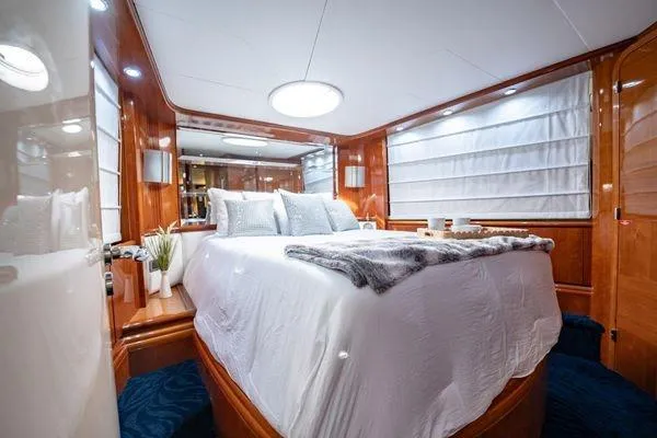 Slide: The Image of Luxurious bedroom interior of 2003 Azimut 80 Carat yacht with elegant wood paneling. - 20