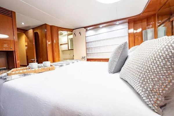 Slide: The Image of Luxurious bedroom interior of 2003 Azimut 80 Carat yacht with elegant decor and plush bedding. - 22
