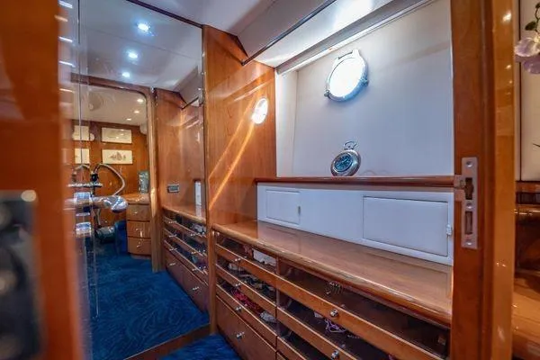 Slide: The Image of Luxurious interior of 2003 Azimut 80 Carat yacht with elegant wood cabinetry and nautical decor. - 25