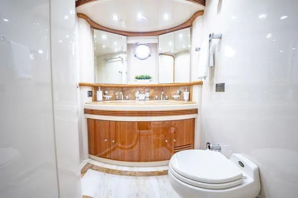 Slide: The Image of Luxurious bathroom on 2003 Azimut 80 Carat yacht with elegant wood cabinetry and modern fixtures. - 26