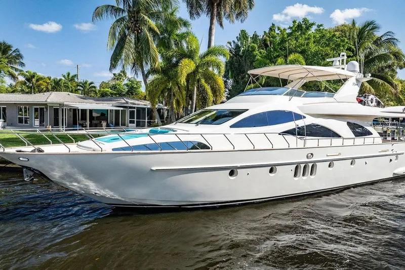Slide: The Image of Luxurious 2003 Azimut 80 Carat yacht docked near tropical waterfront home. - 3