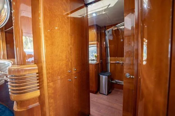 Slide: The Image of Luxurious wooden interior of 2003 Azimut 80 Carat yacht, featuring sleek cabinetry and modern design. - 43