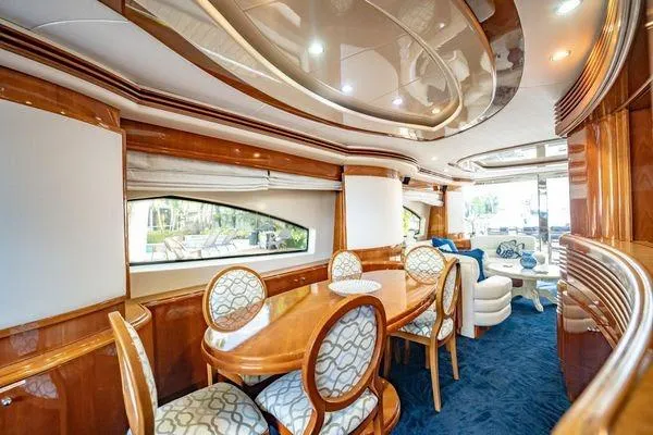 Slide: The Image of Luxurious interior of 2003 Azimut 80 Carat yacht with elegant dining area and plush seating. - 45
