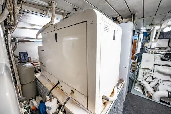 Slide: The Image of Engine room of 2003 Azimut 80 Carat yacht, featuring machinery and equipment. - 64