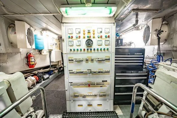 Slide: The Image of Engine room of 2003 Azimut 80 Carat yacht with control panel and equipment. - 66