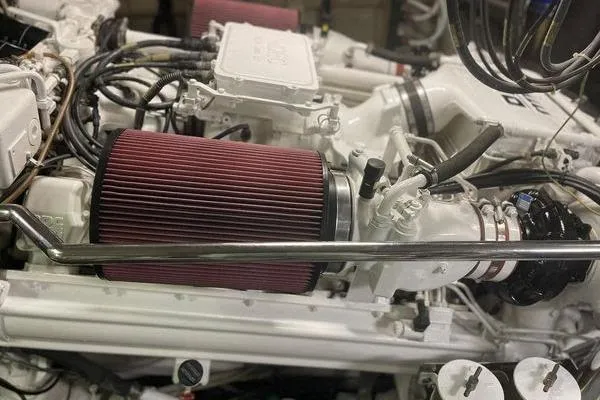 Slide: The Image of Engine compartment of a 2003 Azimut 80 Carat yacht, featuring detailed components and wiring. - 67