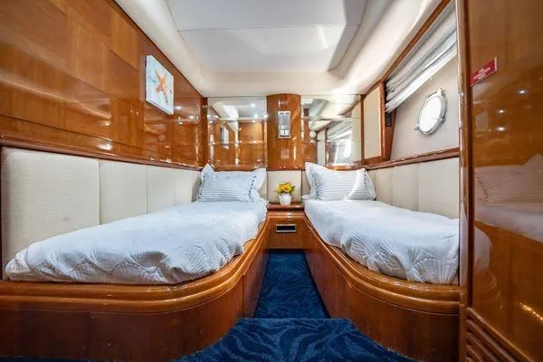Slide: The Image of Luxurious twin cabin interior of 2003 Azimut 80 Carat yacht with elegant wood finish. - 8