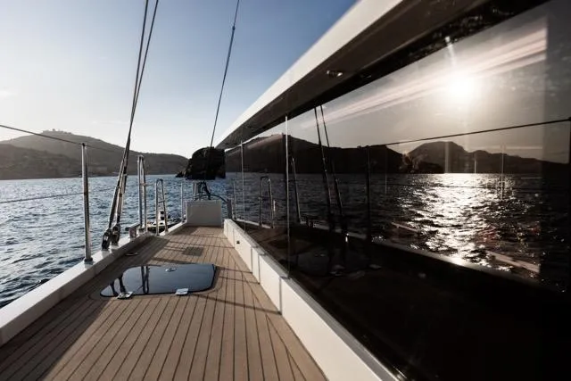 Slide: The Image of Luxurious Eyecat 55 Autumn yacht deck, 2024 model, sailing on serene waters at sunset. - 14