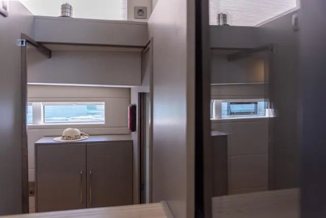 Slide: The Image of Modern interior of Eyecat 55 Autumn 2024 yacht with sleek cabinetry and windows. - 28