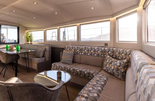 Slide: The Image of Luxurious interior of 2024 Eyecat 55 Autumn yacht with modern seating and dining area. - 39