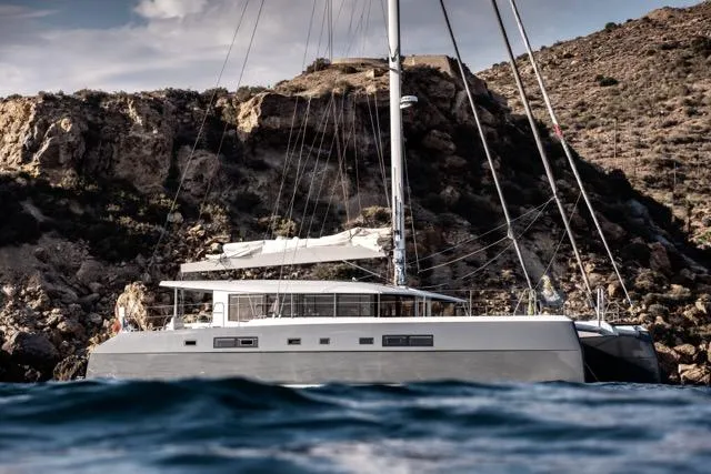 Slide: The Image of Luxurious 2024 Eyecat 55 Autumn yacht sailing near rocky coastline. - 6