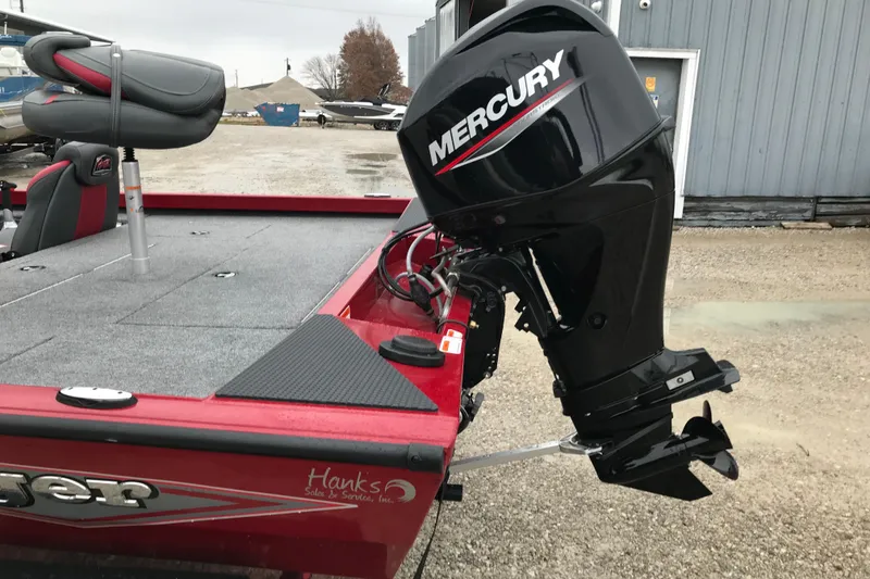 Slide: The Image of 2025 Ranger RT178 boat with Mercury outboard motor, parked on gravel. - 11