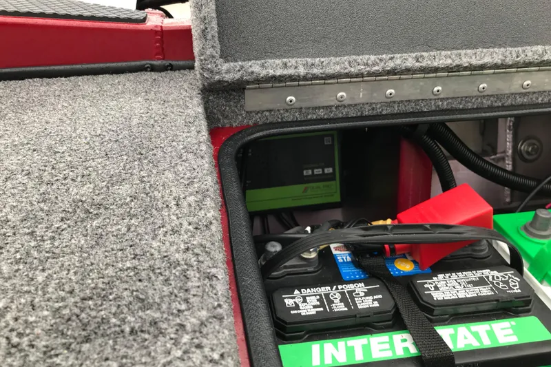 Slide: The Image of 2025 Ranger RT178 boat battery compartment with Interstate battery and wiring. - 13