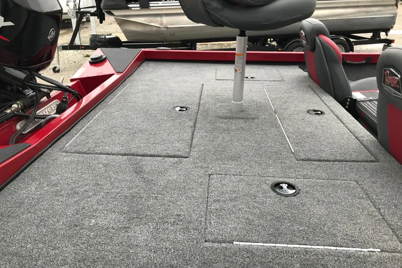 Slide: The Image of 2025 Ranger RT178 boat interior with gray carpet and seating. - 4
