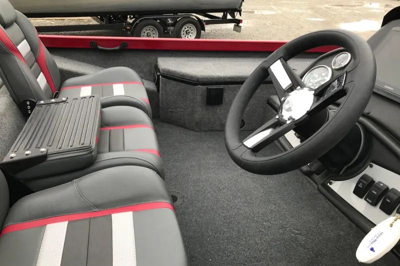 Slide: The Image of 2025 Ranger RT178 boat interior with steering wheel and seating. - 5