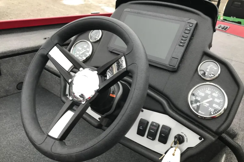 Slide: The Image of 2025 Ranger RT178 boat dashboard with steering wheel and gauges. - 6