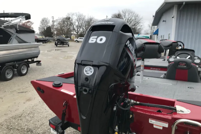 Slide: The Image of 2025 Ranger RT178 boat with Mercury 60 engine, parked outdoors. - 9