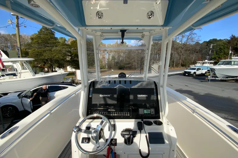 Slide: The Image of 2022 Cobia 280 Center Console boat dashboard with Garmin navigation system. - 11