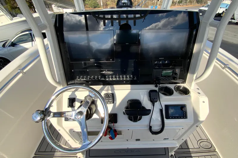 Slide: The Image of 2022 Cobia 280 Center Console helm with advanced navigation and control systems. - 12