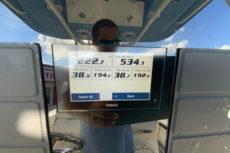 Slide: The Image of Display screen on 2022 Cobia 280 Center Console showing trip data and fuel usage. - 13