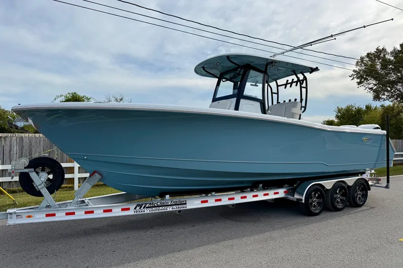 The Image of 2026 Sea Hunt Gamefish 30 Coffin Box boat on trailer, side view. - 1