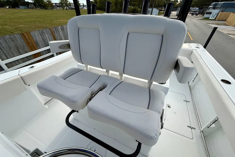 Slide: The Image of 2026 Sea Hunt Gamefish 30 Coffin Box boat seating area, featuring dual cushioned seats. - 10
