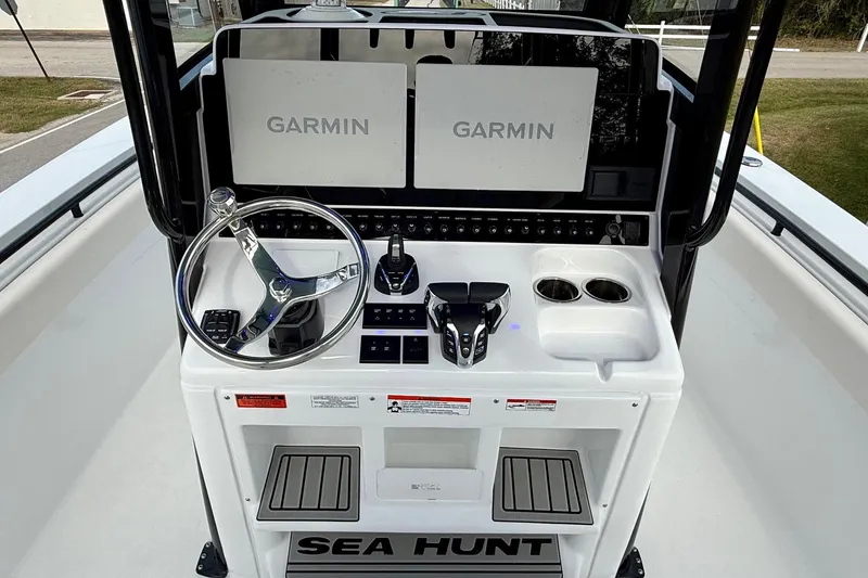 Slide: The Image of 2026 Sea Hunt Gamefish 30 Coffin Box boat dashboard with Garmin displays and steering wheel. - 11