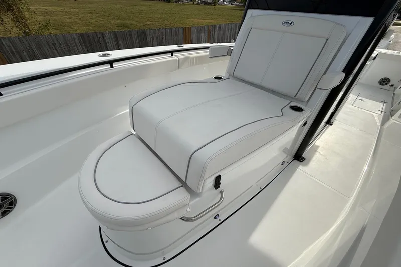 Slide: The Image of 2026 Sea Hunt Gamefish 30 Coffin Box boat with white cushioned seating. - 23