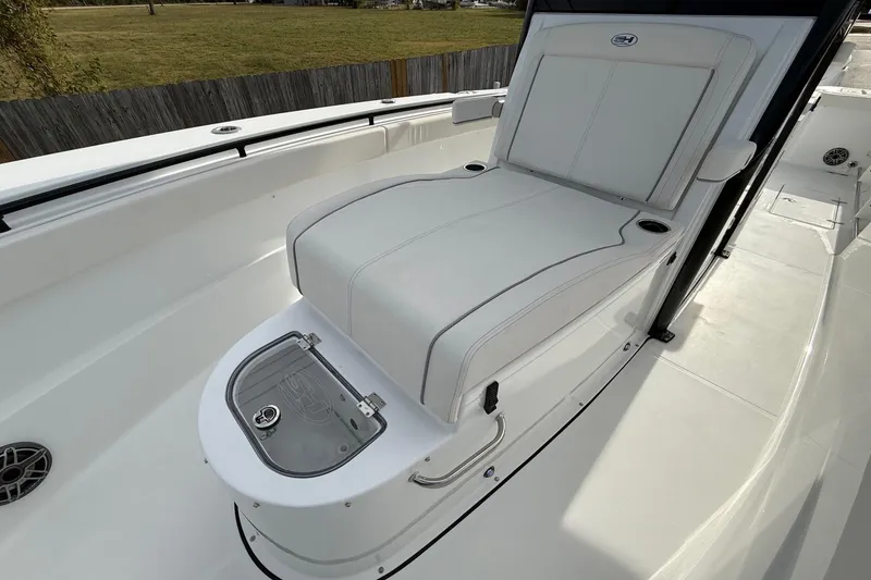Slide: The Image of 2026 Sea Hunt Gamefish 30 Coffin Box boat interior with cushioned seating. - 24