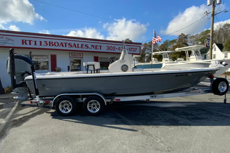 The Image of 2023 Pathfinder 2300 HPS boat on trailer at RT113 Boat Sales dealership. - 1