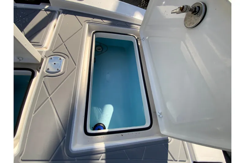 Slide: The Image of Open storage compartment on 2023 Pathfinder 2300 HPS boat, featuring a clean, spacious interior. - 20