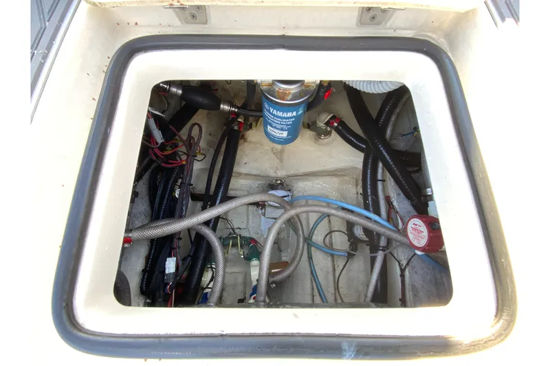 Slide: The Image of Engine compartment of 2023 Pathfinder 2300 HPS boat, showing wiring and components. - 21