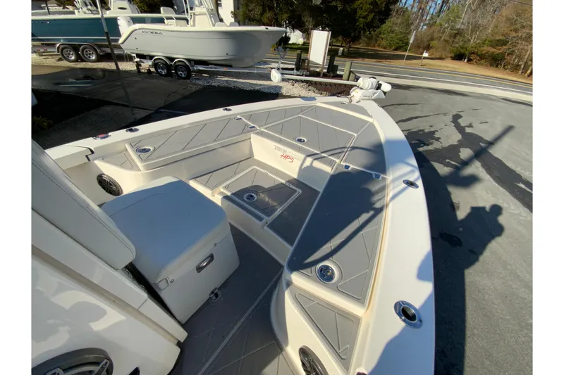 Slide: The Image of 2023 Pathfinder 2300 HPS boat interior with seating and storage compartments. - 23