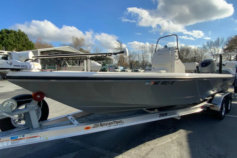 Slide: The Image of 2023 Pathfinder 2300 HPS boat on trailer, under a clear blue sky. - 5