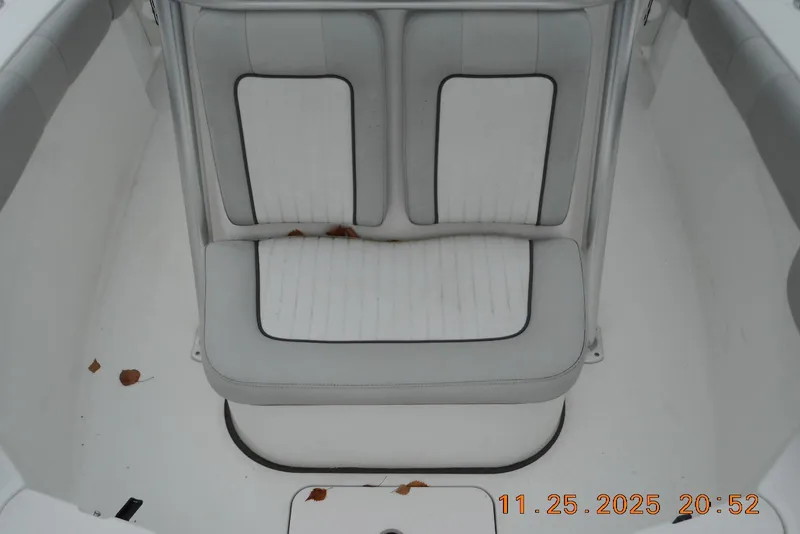 Slide: The Image of 2021 Sea Fox 228 Commander boat seat with white upholstery and black trim. - 11
