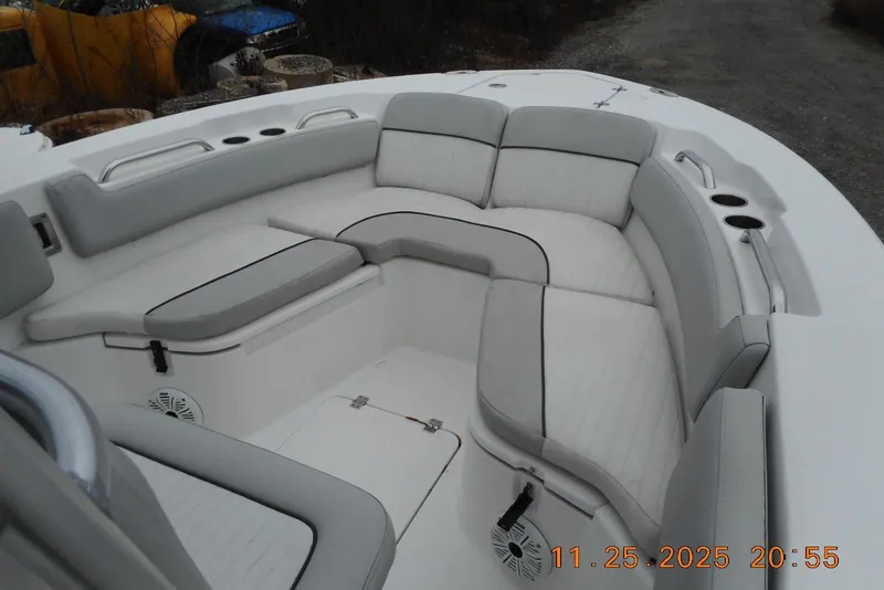 Slide: The Image of 2021 Sea Fox 228 Commander boat interior with cushioned seating and cup holders. - 16