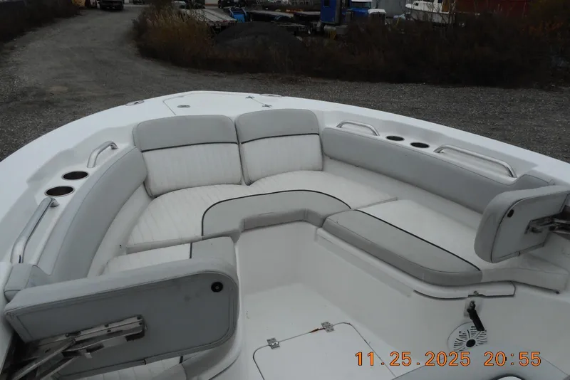 Slide: The Image of 2021 Sea Fox 228 Commander boat interior with cushioned seating and cup holders. - 17