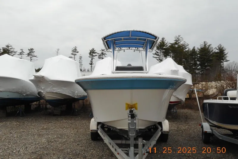Slide: The Image of 2021 Sea Fox 228 Commander boat on trailer, surrounded by covered boats. - 3