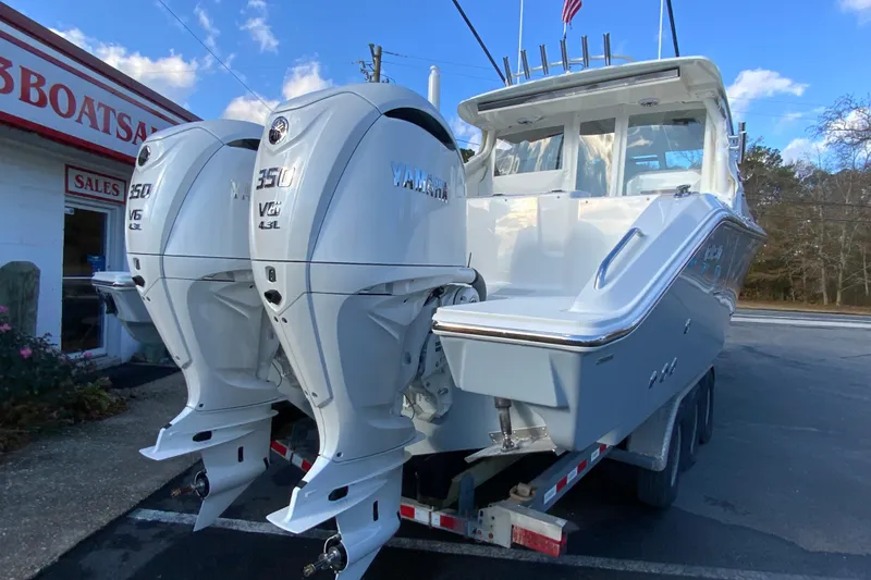 Slide: The Image of 2026 Pursuit DC 326 Dual Console boat with twin Yamaha 350 V6 engines. - 10