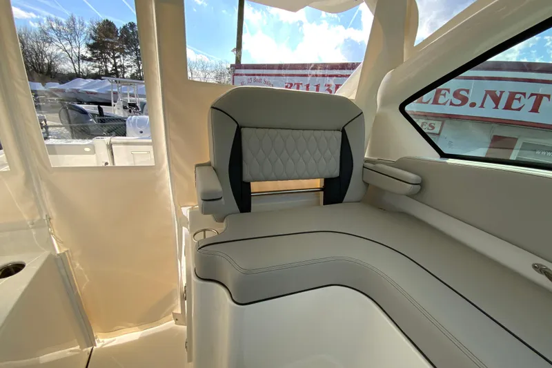 Slide: The Image of 2026 Pursuit DC 326 Dual Console boat interior with luxurious seating and modern design. - 28