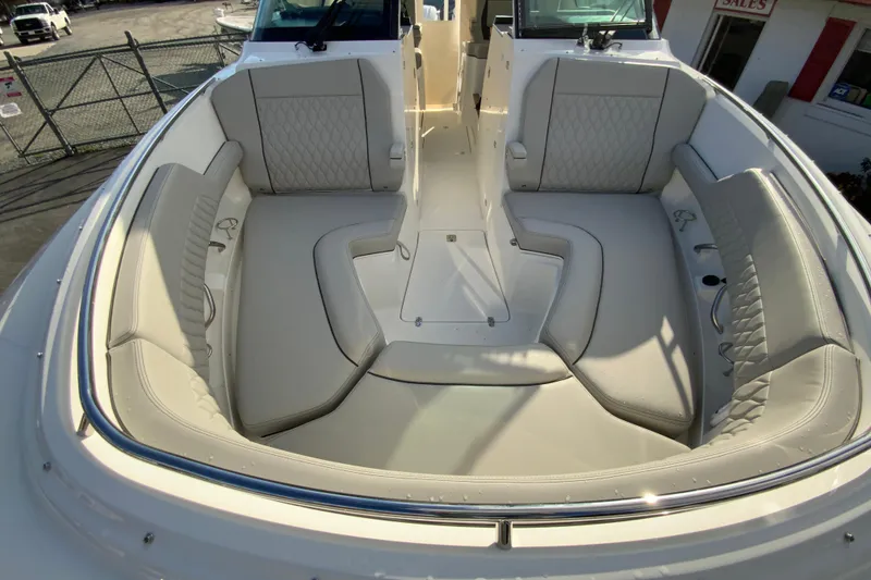 Slide: The Image of 2026 Pursuit DC 326 Dual Console boat interior with luxurious seating and modern design. - 35
